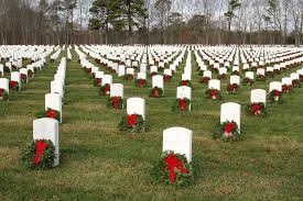 National cemetery with wreaths arranged on headstones